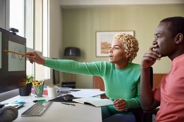 Salespeople reviewing the BANT framework before a discovery call with a prospect